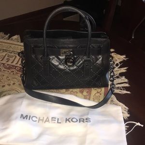 Brand new, never used Black Michael Kors hand bag.